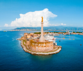 Messina, Sicily, Italy, August 20, 2022. View of the Messina's port with the gold Madonna della Lettera statue